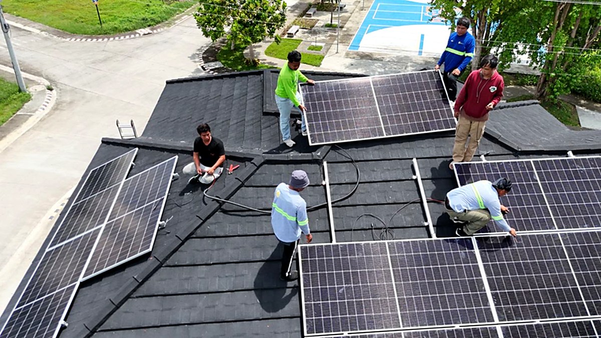 Flexsol crew installing solar panels